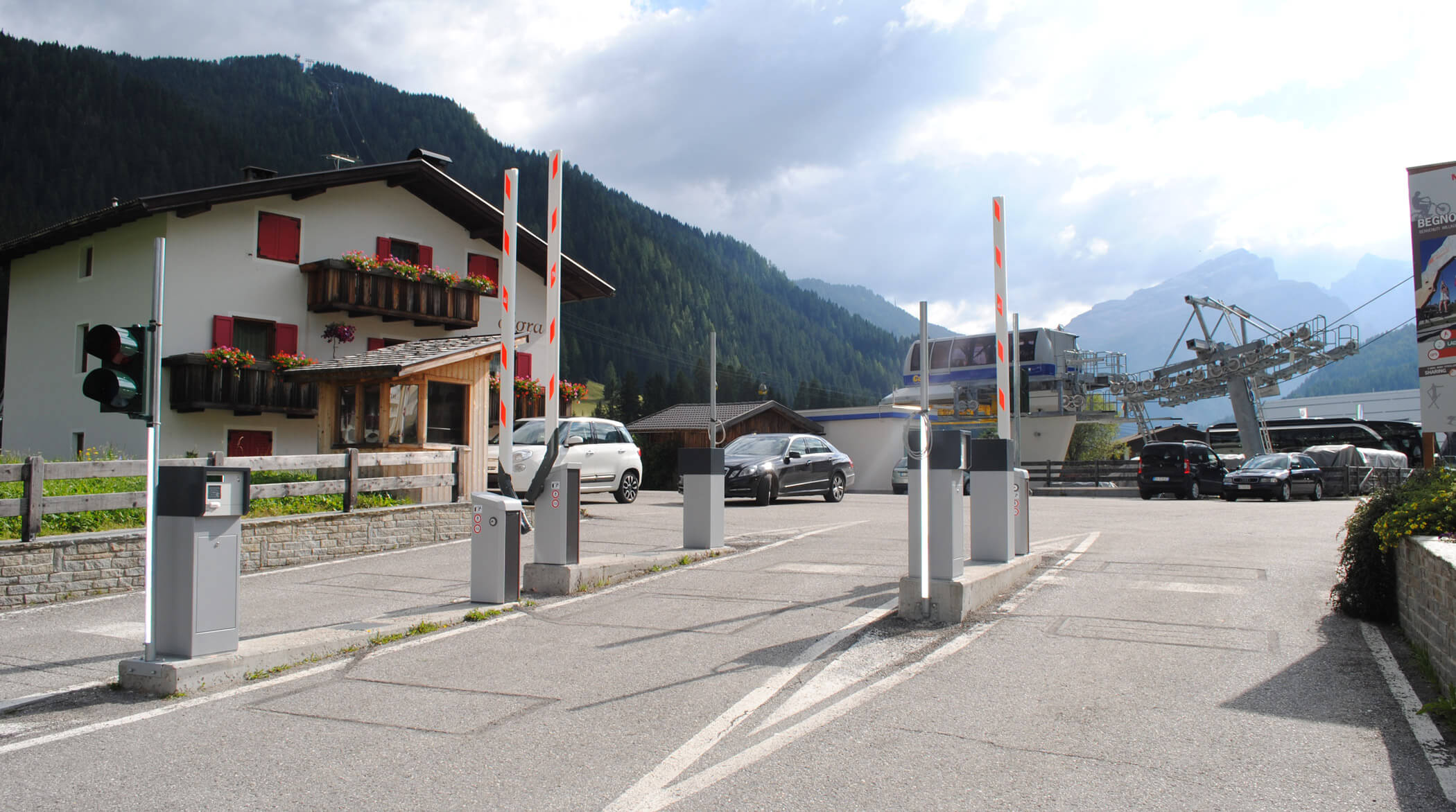 Parkschein Automat (car parking ticket machine) in front of huge mountains  in Tirol, Austria. Travelling in Europe with a car and looking for a  parking lot. The environment is beautiful. Nature Stock